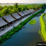 Home 23 하천 생태계 복원과 물 관리 정책의 통합 - Photorealistic aerial view of a restored urban river corridor in Vietnam at sunrise, clear winding w...